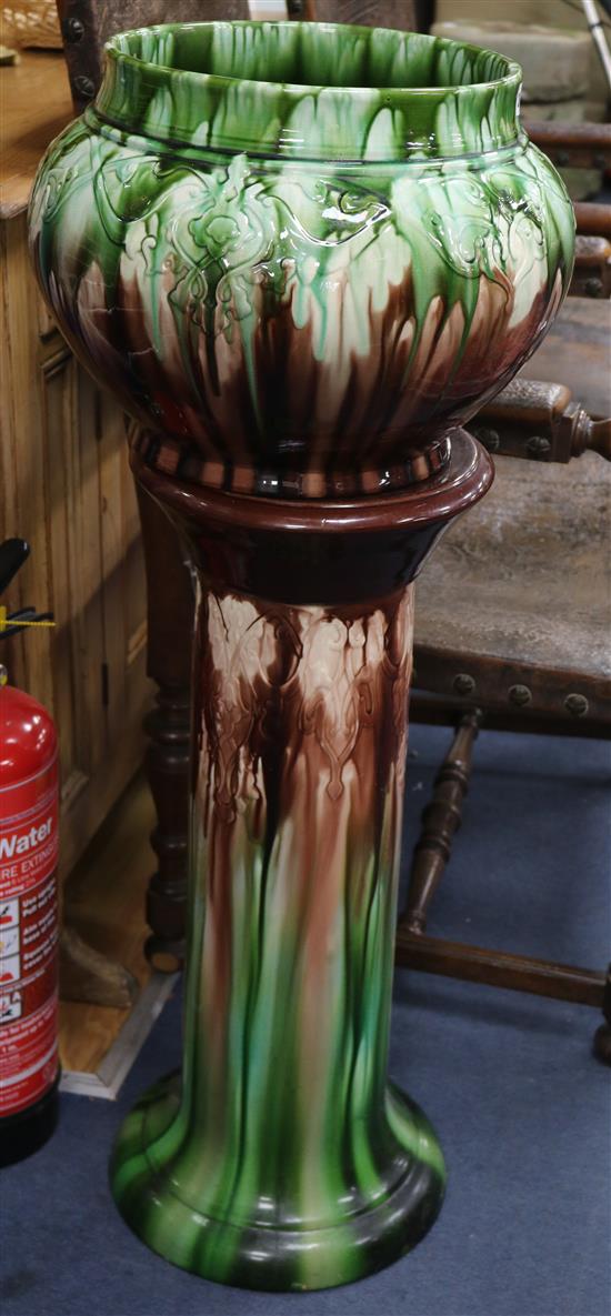 A Victorian pottery jardiniere on stand